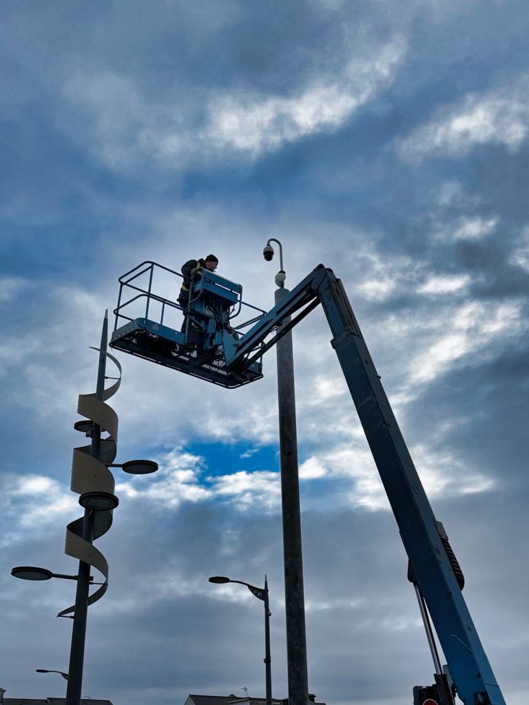 Advanced Overwatch engineer working on a pole-mounted CCTV camera