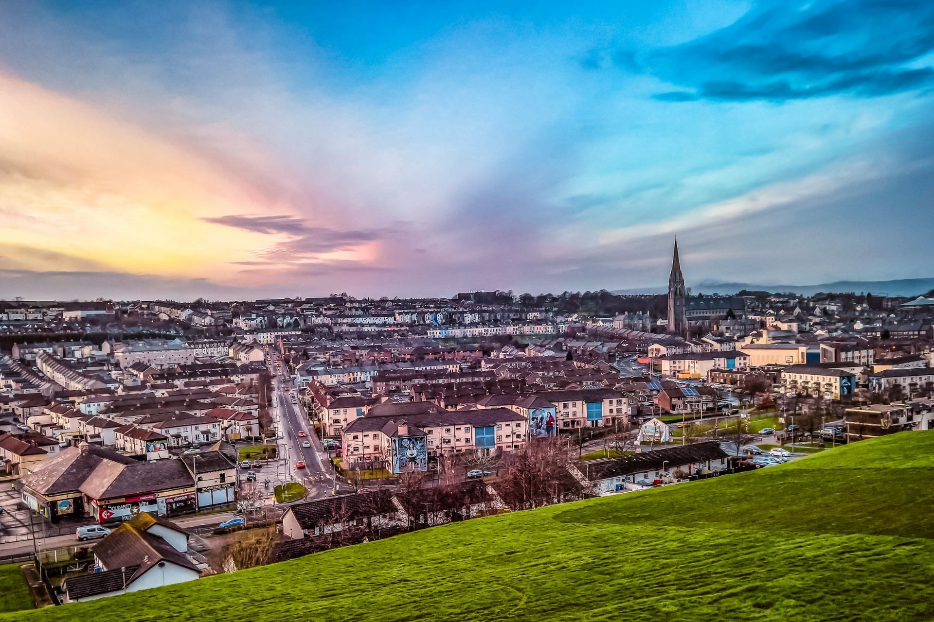 View over Derry rooftops and the city at dusk