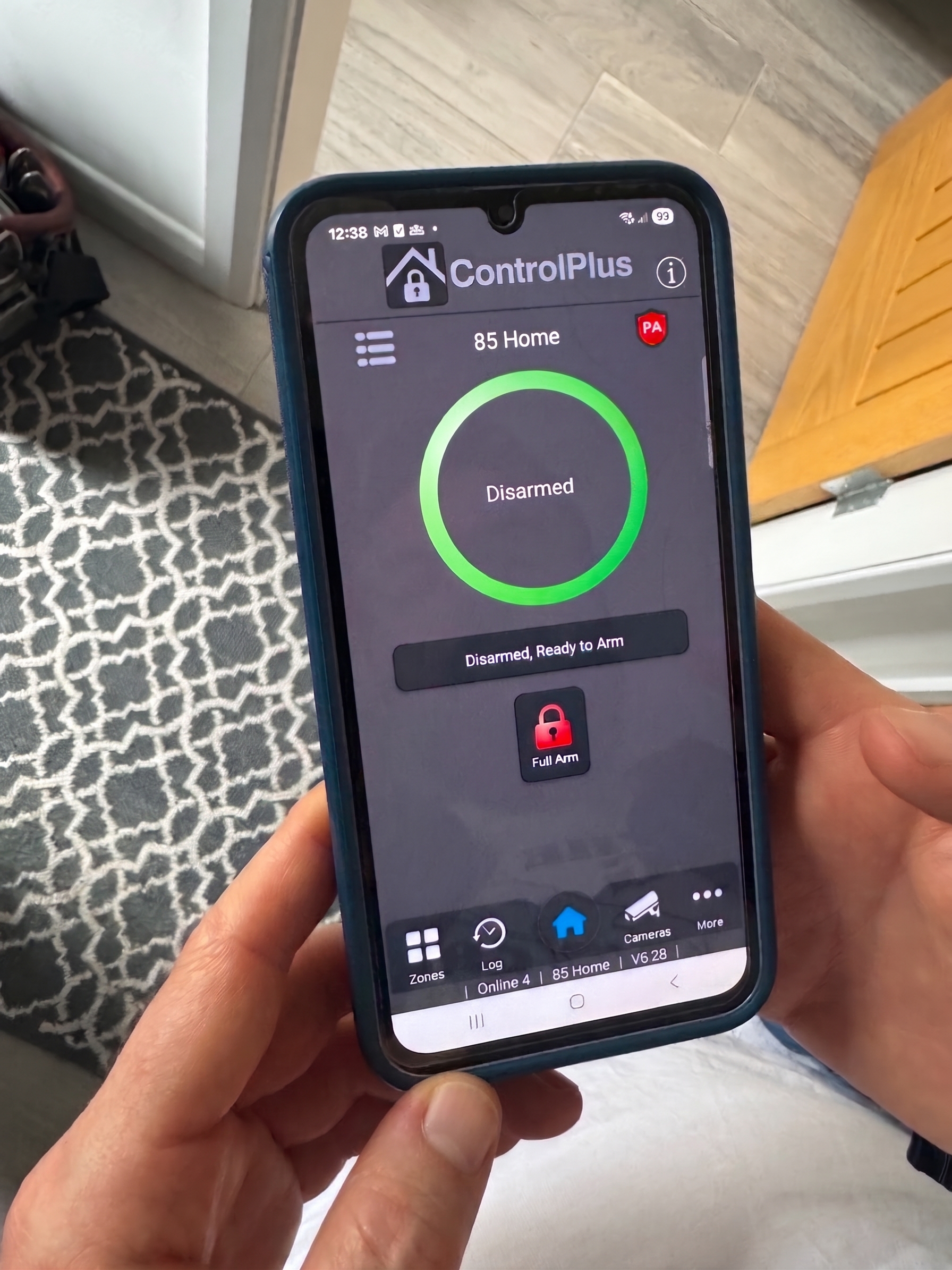 Customer alarm app being set up on a phone at handover