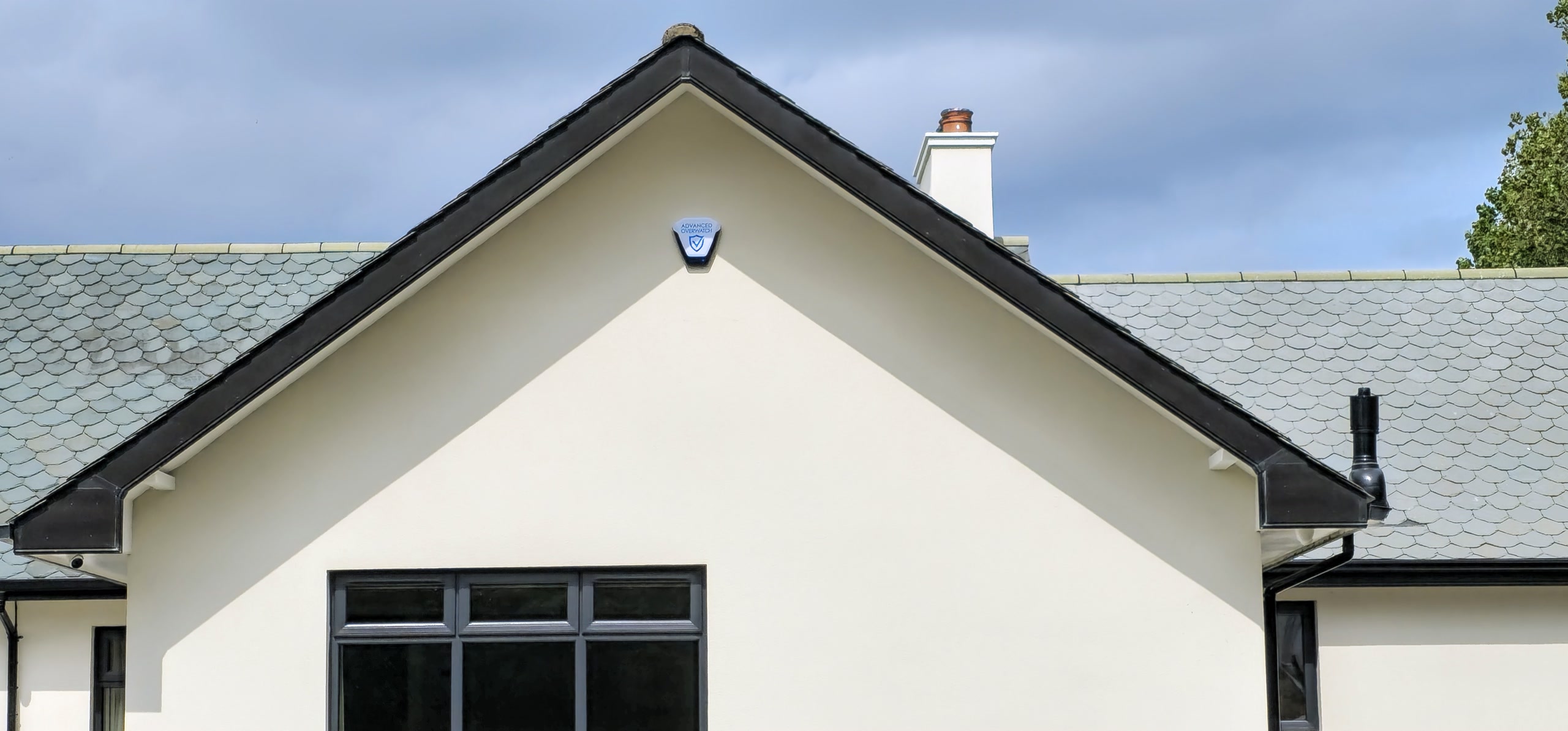 Advanced Overwatch external alarm sounder on a house gable wall